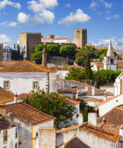 Roofs and castle of Obidos, a medieval fortified village in Portugal